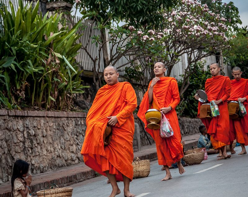 Each morning in Luang Prabang, Laos Buddhist monks carry out the morning alms procession.