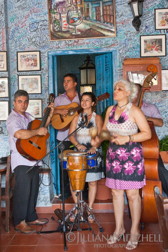 Cuban band plays in La Bodeguita del Medio, apparently once Hemingway's favourite bar in Old Havana and considered the birthplace of the Mojito.