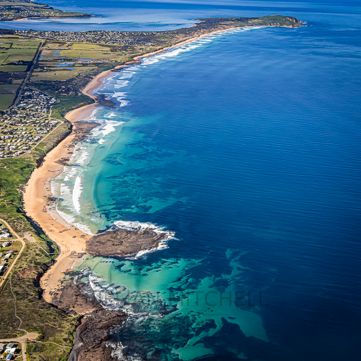 Aerial view along the southern coast of Phillip Island from Sunderland Bay to Cape Woolamai.